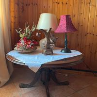 Tavolino rotondo da salotto con piano in vetro