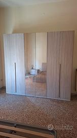 Armadio a sei ante effetto rovere chiaro