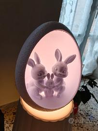 uovo con famiglia di coniglietti di pasqua 