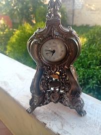 orologio antico in lega