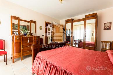 Camera da letto più cucina