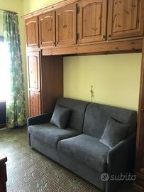 Monolocale arredato angolo/cottura e divano letto