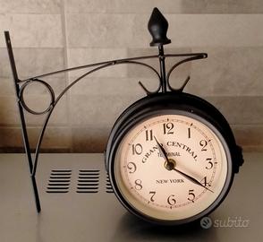 Orologio bifacciale da parete