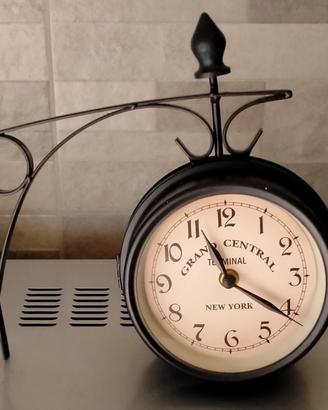 Orologio bifacciale da parete