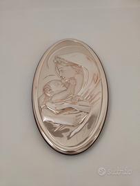 Quadro ovale in argento e legno.