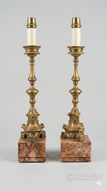 Coppia di candelieri in bronzo in stile barocco