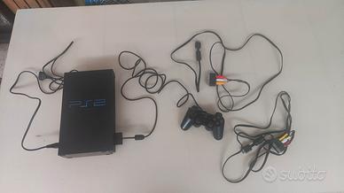 PS2 Fat+chitarra Kramer wirless e 5 giochi