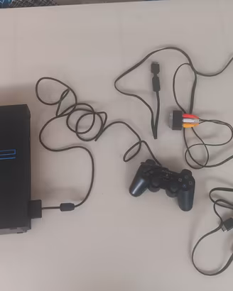 PS2 Fat+chitarra Kramer wirless e 5 giochi