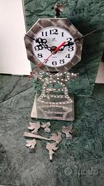 OROLOGIO IN ACCIAIO D' ARREDO A PENDOLO A MANO