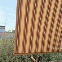 TENDA DA BALCONE A CADUTA CON BRACCI