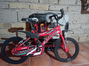 Bicicletta bimbo 5,6 anni più pattini nuovissimi