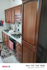 cucina ,mobile sala , frigorifero , divano