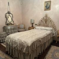 Letto singolo in ferro battuto dorato