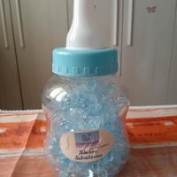 Salvadanaio biberon e 150 ciucci azzurro