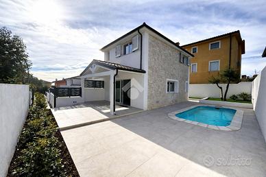 VILLA A SCHIERA A BAUNEI