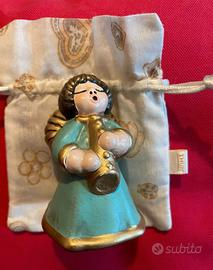 Thun Angelo con veste celeste e flauto dorato