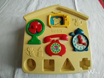 Giocattolo vintage Tomy a forma di casetta 