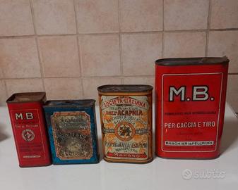 Antiche scatole di latta per polvere da sparo
