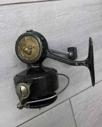 A Vintage Fishing Reel, The Ambidex From J.W. Young On A Black Background 86580204