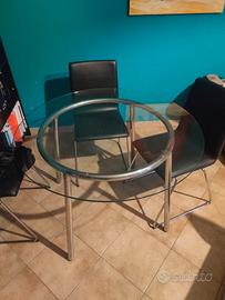 Tavolo tondo di vetro e 4 sedie