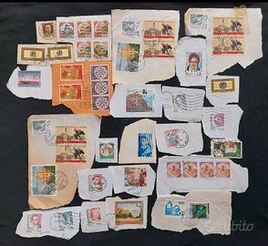 Francobolli su frammenti di carta 166 pezzi
