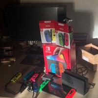 Nintendo Switch 64GB- 6  joystick + 2 giochi