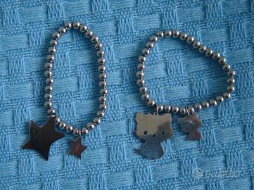 Coppia di bracciali in metallo con stella e gatto
