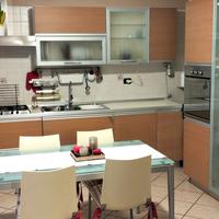 Cucina completa di tavolo e sedie