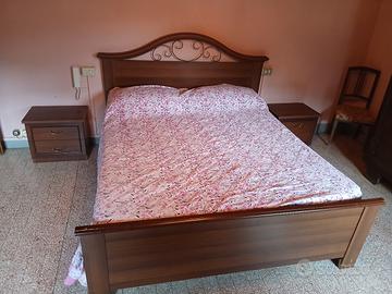 Due letti matrimoniali e  comodini