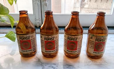 Gruppo 4 bottiglie vintage Birra Forst.