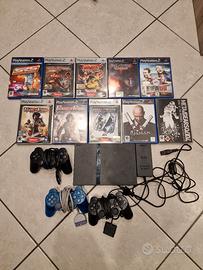 Playstation 2 con tre joystick e 9 videogiochi 