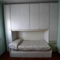 Camera da letto singola con armadio a ponte
