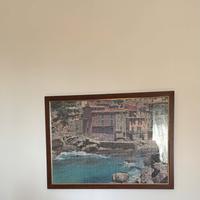 Quadro puzzle borgo sul mare incorniciato in legno