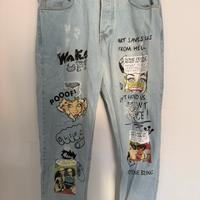 Jeans strappato con scritte e disegni 100% cotone