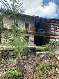 Porzione di rustico terratetto con terreno