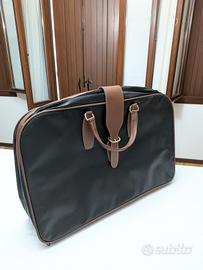Valigia vintage più beauty case in pelle