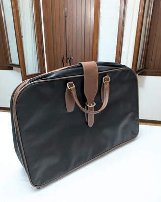 Valigia vintage più beauty case in pelle