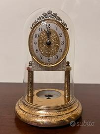 Orologio a pendolo a torsione