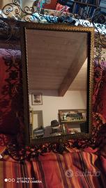 Specchio con cornice in ferro battuto