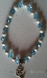 BRACCIALE ELASTICO *simbolo OHM*CON PERLE ARGENTO