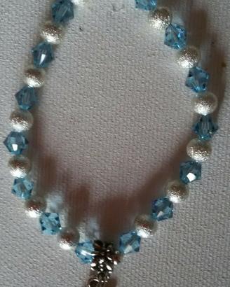 BRACCIALE ELASTICO *simbolo OHM*CON PERLE ARGENTO