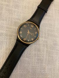 Swatch new gent nero ed oro funzionante.