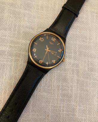 Swatch new gent nero ed oro funzionante.