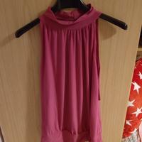 blusa senza maniche fucsia collo alto