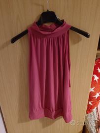 blusa senza maniche fucsia collo alto
