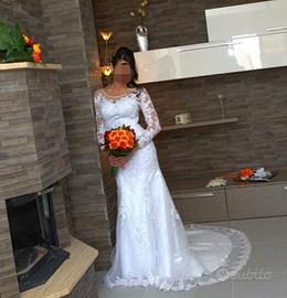 Vestito da sposa artigianale in pizzo ricamato