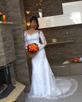 Vestito da sposa artigianale in pizzo ricamato