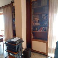 Libreria doppia cristallo con curva centrale
