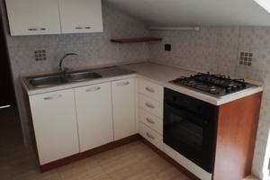 Trilocale mansardato con ascensore e balcone