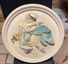 Quadro rotondo in bassorilievo